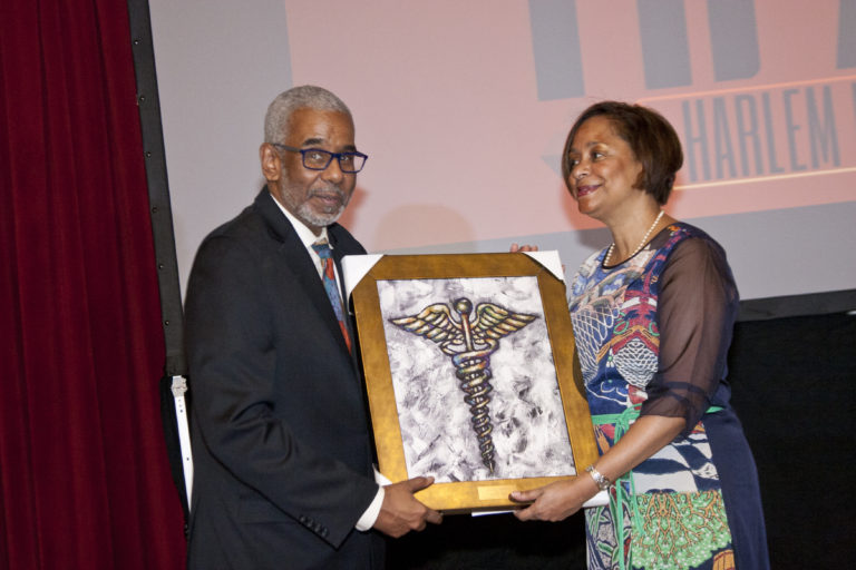Dr. Ross accepting award