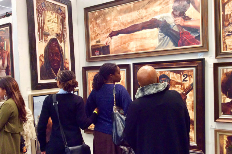 Guests engaging with art at the Kevin Williams exhibit