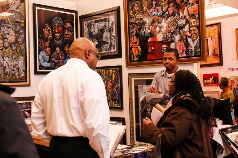 Guests engaging with art and artist Timothy Giles